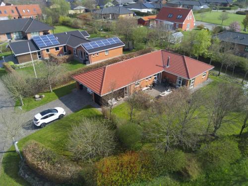 an aerial view of a house with solar panels on it at Anita's B & B in Jelling