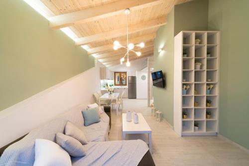 a living room with a couch and a table at Feels like Home in Rethymno Town