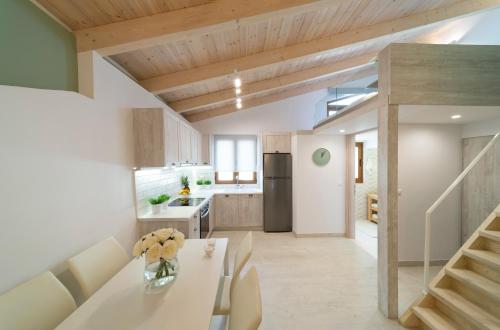 a kitchen and dining room with a table and chairs at Feels like Home in Rethymno Town