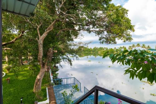 a view of a lake from a house at Warmth Lake Haven in Alleppey