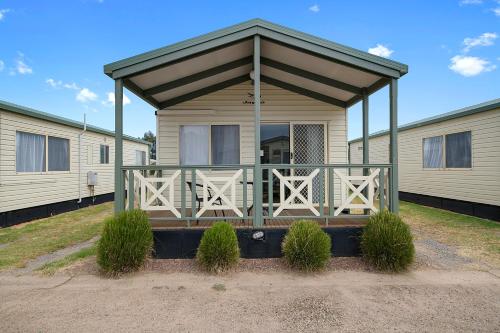 a screened in porch on a mobile home at Benalla Tourist Park in Benalla