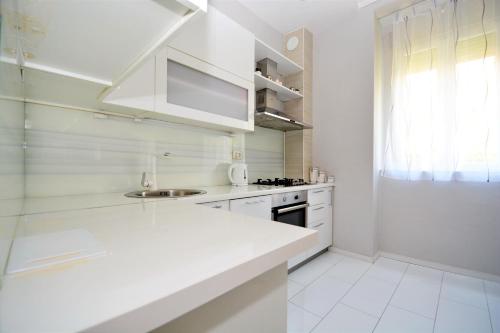 Kuchyňa alebo kuchynka v ubytovaní Apartment Populare