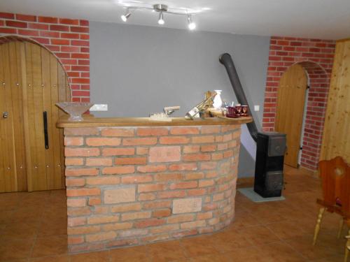 a brick oven in a room with a brick wall at Penzion Imrichovi in Moravská Nová Ves
