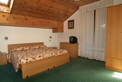 Postel nebo postele na pokoji v ubytování Hotel Torretta