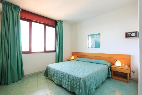 Кровать или кровати в номере Hotel Soleado