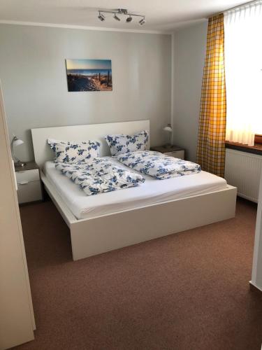Кровать или кровати в номере Rekwai 413
