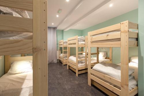Ένα ή περισσότερα κρεβάτια σε δωμάτιο στο Balea Hostel