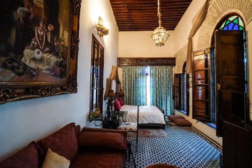 Postel nebo postele na pokoji v ubytování Riad Arabesque & Spa