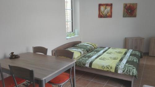 Postel nebo postele na pokoji v ubytování Apartmány U Jakuba