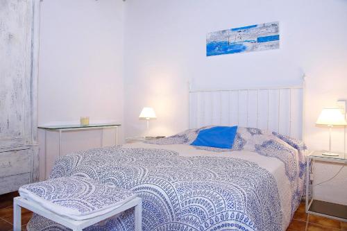 En eller flere senge i et værelse på Finca Sa Cabaneta 235 by Mallorca Charme