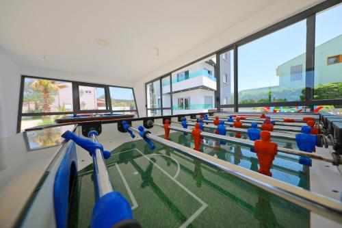 a row of people in an empty gym at Boutique Apartments Ad Astra in Bibinje