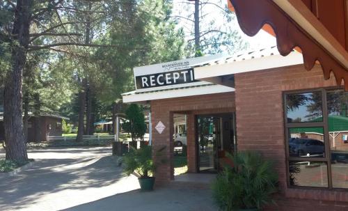 a red brick building with a repair sign on it at Mountainview Inn in Harrismith