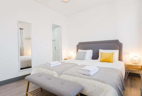 מיטה או מיטות בחדר ב-Hola Málaga Premium Centro