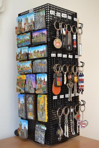 a wall filled with lots of different types of keychains at Pension Nika in Prague