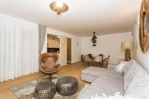 a living room with a couch and a table at Perla Apartmani Split in Split