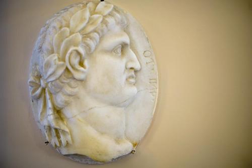 a white marble bust of a woman on a wall at Hotel Villa Cimbrone in Ravello