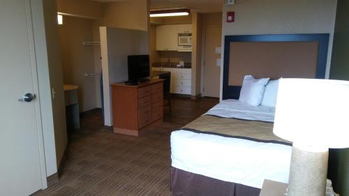 a hotel room with a bed and a television at Extended Stay America - Atlanta - Marietta - Interstate N. Pkwy in Atlanta