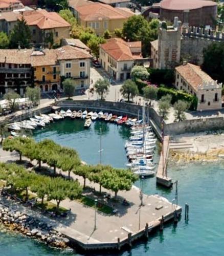 an aerial view of a marina with boats in the water at Suite La Castellana in Torri del Benaco