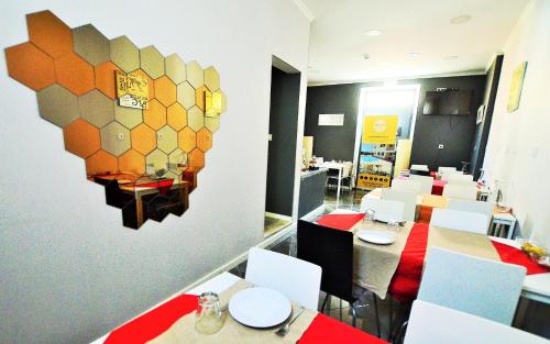 a room with a table, chairs, and a table cloth at Suites & Apartments DP VFXira in Vila Franca de Xira