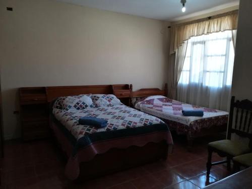 Кровать или кровати в номере Apartamento Golden