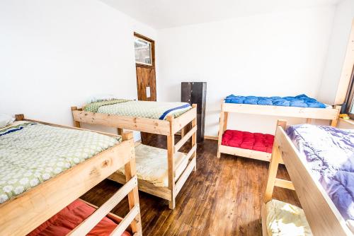 Ένα ή περισσότερα κρεβάτια σε δωμάτιο στο Hostal Licanantay