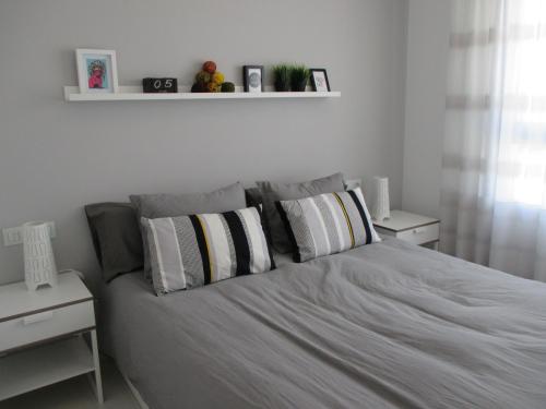 En eller flere senge i et værelse på Playa Elisa Bay