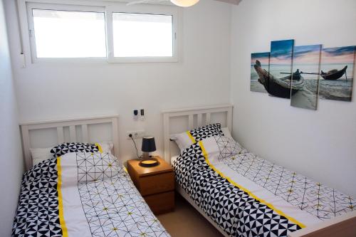 Voodi või voodid majutusasutuse Alhama Golf Penthouses P02 toas