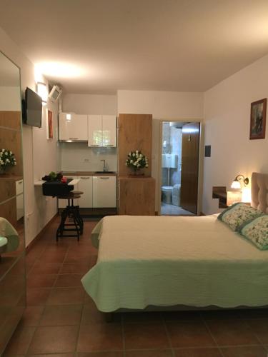 Postel nebo postele na pokoji v ubytování Goga Apartments