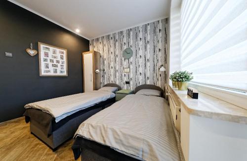 Cama o camas de una habitación en Pokoje u Małgosi