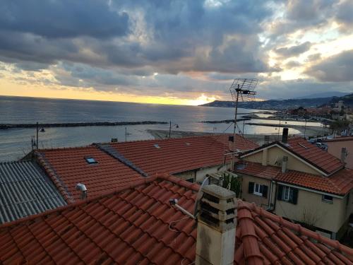 a view of the ocean from the roofs of buildings at Il Convento sul Mare in Santo Stefano al Mare