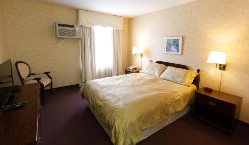 Ένα ή περισσότερα κρεβάτια σε δωμάτιο στο Auberge La Rocaille