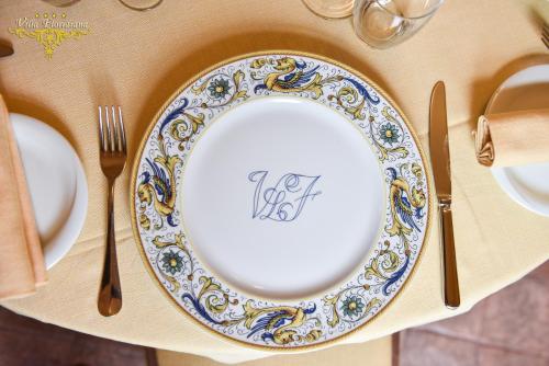 a plate on a table with a fork and knife at Villa Floridiana in Anagni