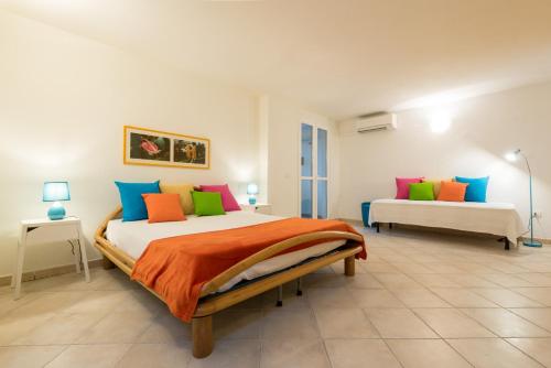 A bed or beds in a room at Apartment in S'Abba e Sa Pedra with pool