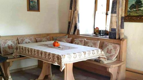 a table with a pumpkin on top of it at Ferienhaus am Mühlbach in Kinding