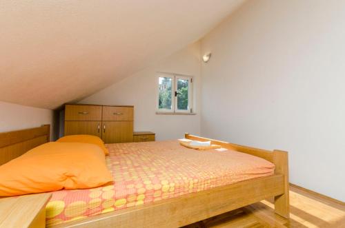 Postel nebo postele na pokoji v ubytování Apartments Ivo