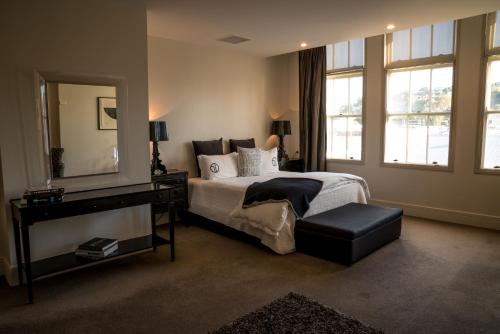 A bed or beds in a room at The Dome Boutique Apartments