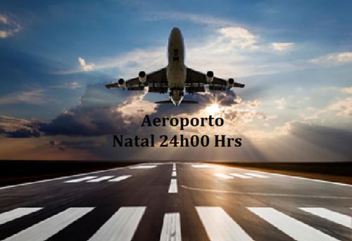 an airplane taking off from an airport runway at Casa do Mochileiro Airport Hostel & Pousada in São Gonçalo do Amarante