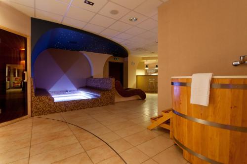 a hotel lobby with a room with a star ceiling at Hotel Swing in Kraków