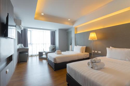 Lova arba lovos apgyvendinimo įstaigoje Top View Hotel - SHA Extra Plus