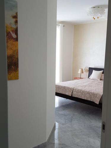 Ένα ή περισσότερα κρεβάτια σε δωμάτιο στο Residenza delle Grazie