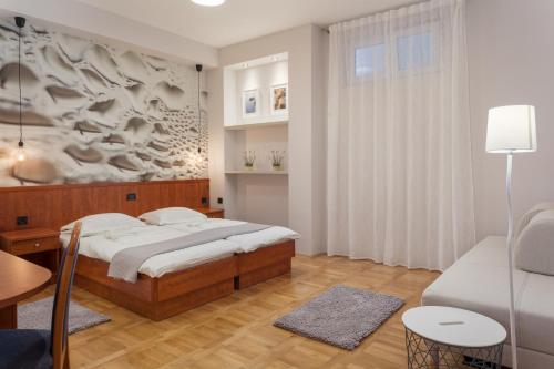Giường trong phòng chung tại Villa Vinka