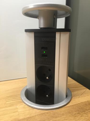 a black and white blender sitting on a wooden floor at Apartment DOWNTOWN in Brno