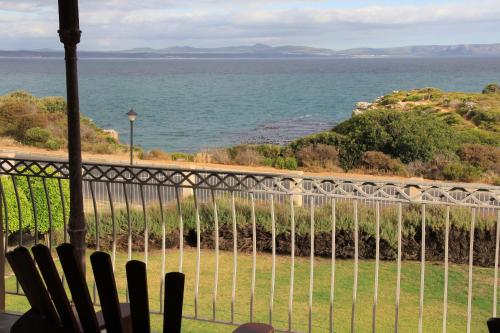 a view of the ocean from a balcony at On The Cliff Guest House in Hermanus