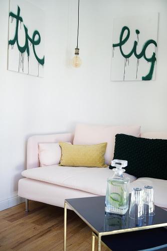 a living room with a white couch and a table at Victoria Hotel in Düsseldorf