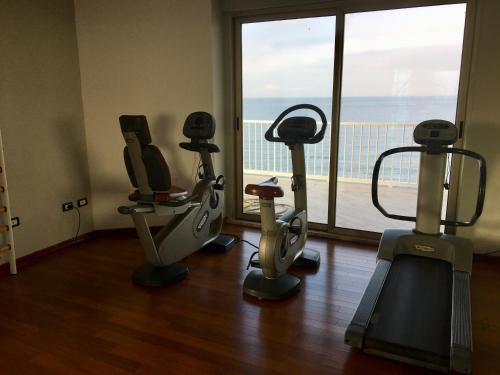 a gym with two exercise bikes and a window at Grand Hotel L'Approdo in Terracina
