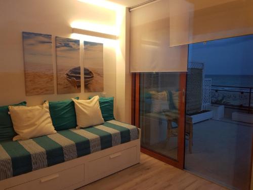A bed or beds in a room at Appartamenti FronteMare