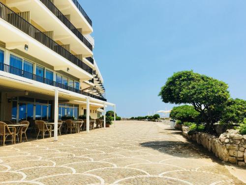 a cobblestone street in front of a building at Grand Hotel L'Approdo in Terracina