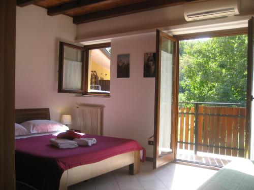 Ένα ή περισσότερα κρεβάτια σε δωμάτιο στο Agriturismo Radovic