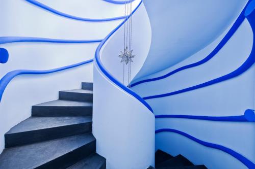 a stairway with a snowflake hanging from a glass pane at Riad Goloboy in Marrakech