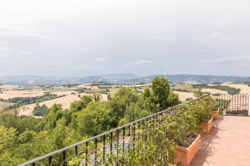 a row of plants on a fence with a view at Casa Oliva borgo del Benessere Olistico in Bargni
